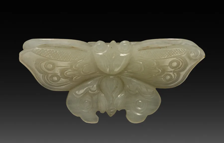 Nephrite pendant carved as a butterfly with incised wing patterns