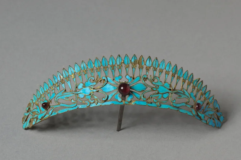 Gilded silver headdress ornament surfaced with iridescent kingfisher feathers