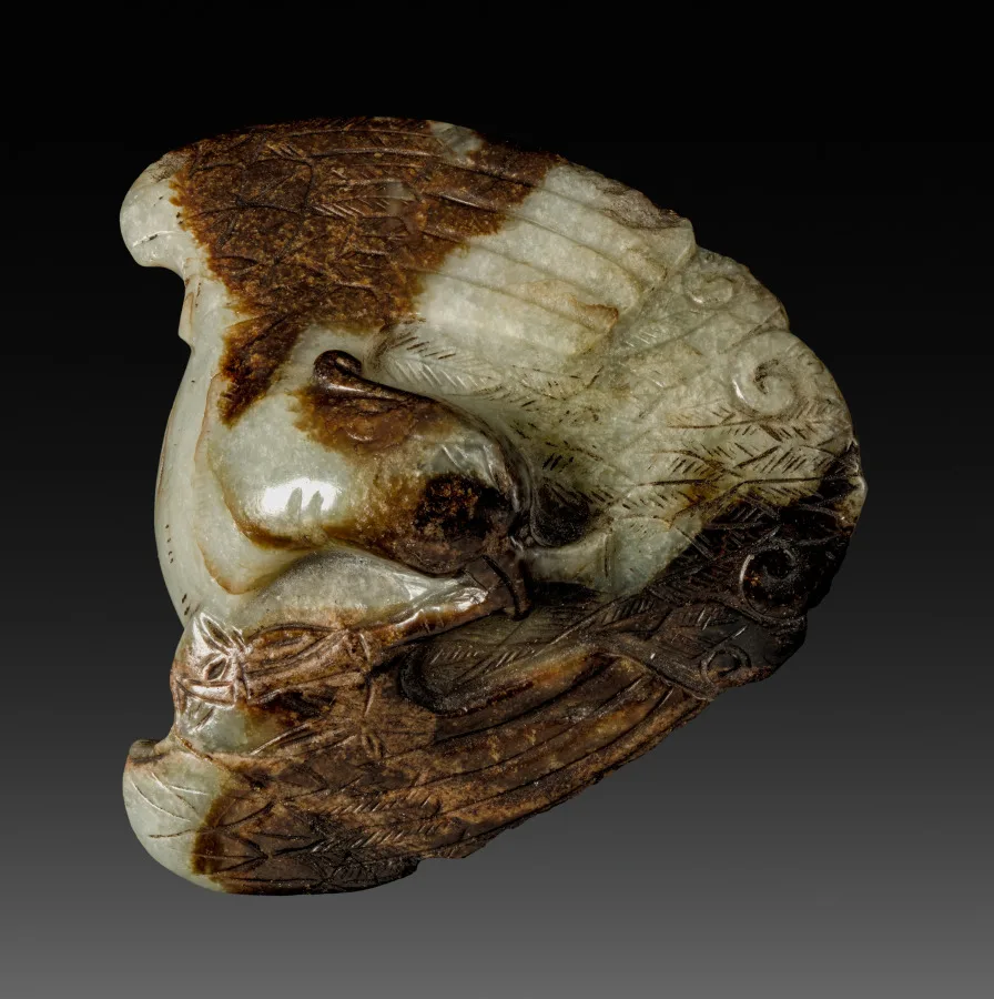 Small nephrite pendant with carved surface detail