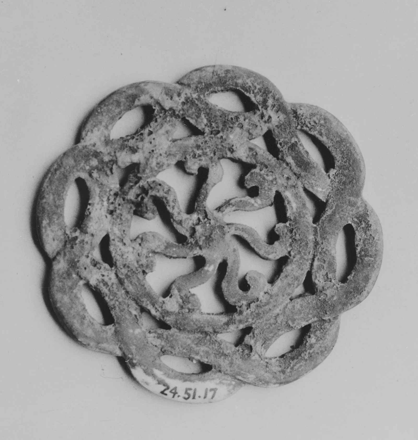 Jade (nephrite) pendant, ming dynasty, 5.1 cm across.