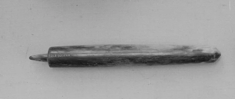 Jade (nephrite) pendant, prehistoric china, 11.1 cm long.