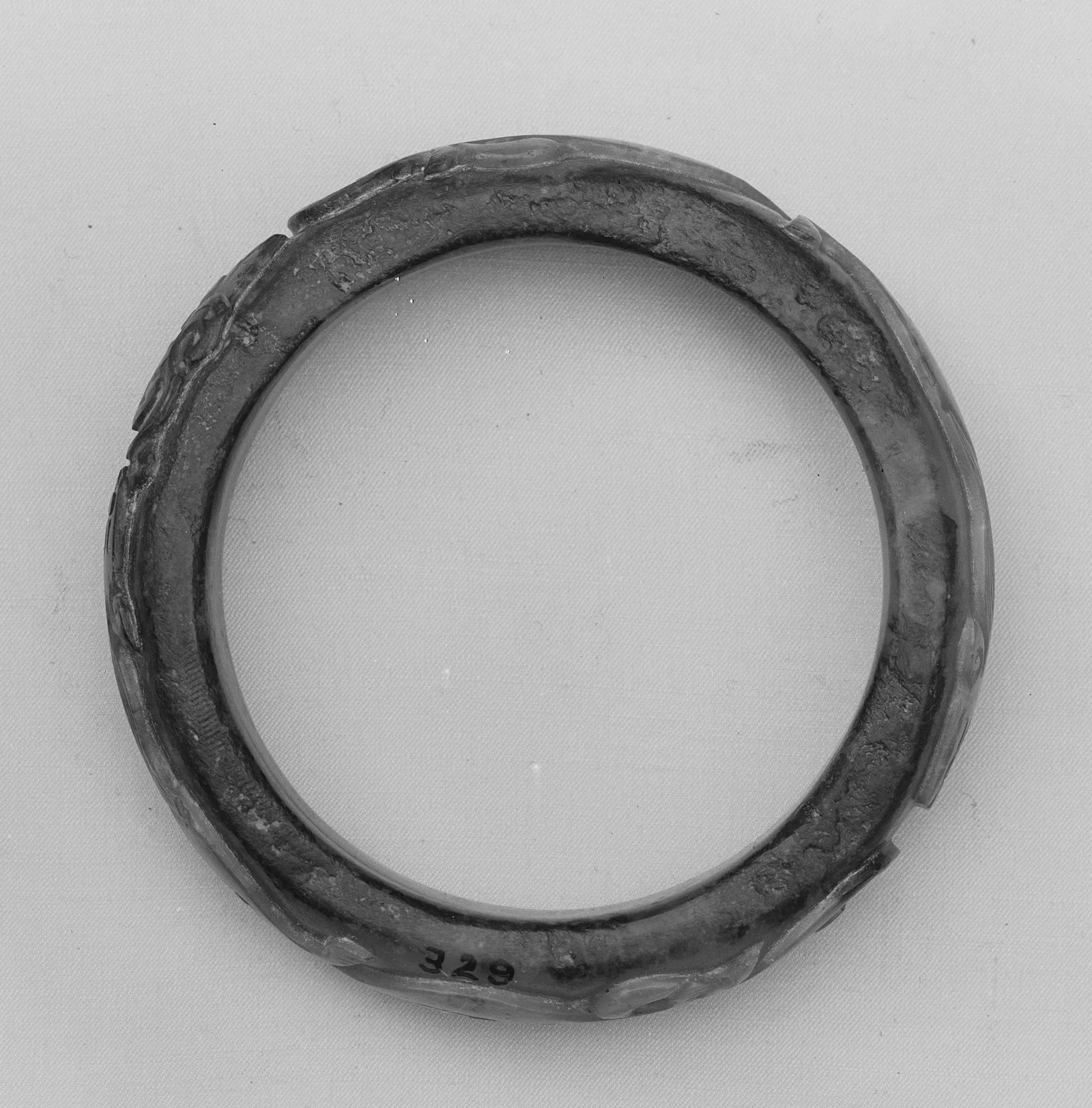 Jade (nephrite) armlet, qin and han dynasties, 12.5 cm high.