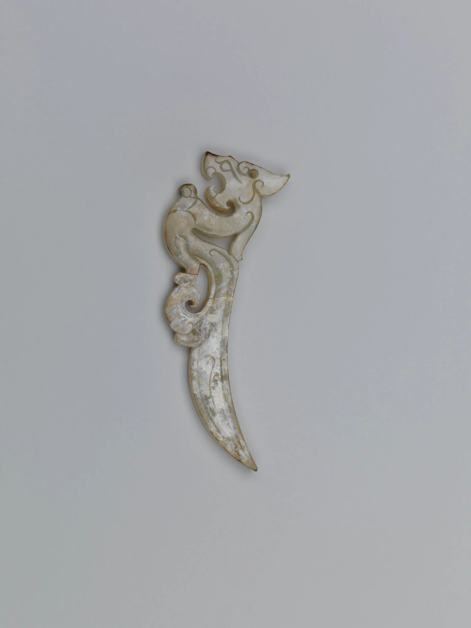 Jade (nephrite) pendant, in the shape of a dragon, shang and zhou dynasties, 6 cm high.