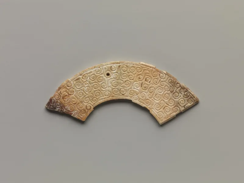 Jade (nephrite) pendant, shang and zhou dynasties, 3 cm high.