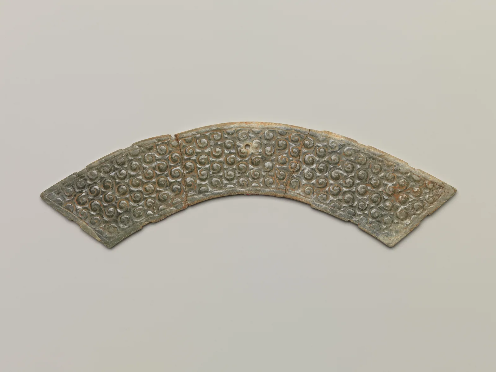 Jade (nephrite) pendant, shang and zhou dynasties, 3.8 cm high.