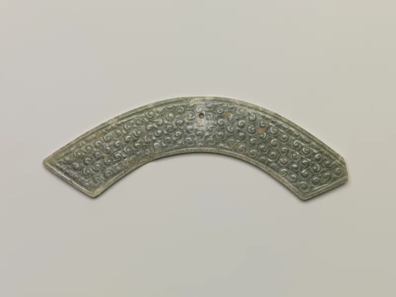 Jade (nephrite) pendant, shang and zhou dynasties, 3.8 cm high.